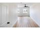 Bright bedroom featuring new light wood flooring and a ceiling fan at 1891 Brian Rd, Pahrump, NV 89048