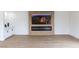 Custom entertainment center featuring a large TV, linear fireplace, and custom cabinets at 1891 Brian Rd, Pahrump, NV 89048