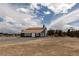 An exterior shot highlighting the spacious property with views of mountains at 1891 Brian Rd, Pahrump, NV 89048