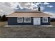 Front exterior with double doors, clean lines, and mountain views in the background at 1891 Brian Rd, Pahrump, NV 89048