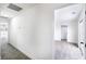 Well-lit hallway with plush carpet leading to open bedroom and glass door at 1891 Brian Rd, Pahrump, NV 89048