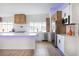 Modern kitchen with white cabinets, stainless steel appliances, large island with accent lights, and ample counter space at 1891 Brian Rd, Pahrump, NV 89048