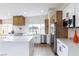 Modern kitchen features white cabinets, a large island, stainless steel appliances, and a striking backsplash at 1891 Brian Rd, Pahrump, NV 89048