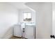 Bright laundry room featuring new washer and dryer with window view at 1891 Brian Rd, Pahrump, NV 89048