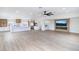 Open living room and kitchen featuring an entertainment center with a large TV and electric fireplace at 1891 Brian Rd, Pahrump, NV 89048