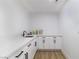 Pantry with white cabinets, matte black hardware, a sink, countertops, and plenty of storage space at 1891 Brian Rd, Pahrump, NV 89048