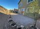 Backyard features low maintenance landscaping, patio and privacy wall at 22 Kaku Ridge Way, Las Vegas, NV 89183
