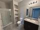 Bathroom with a walk in shower, granite countertop and modern fixtures at 22 Kaku Ridge Way, Las Vegas, NV 89183