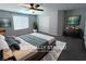 Inviting bedroom with soft textures, neutral colors, and a large window, promoting rest and relaxation at 22 Kaku Ridge Way, Las Vegas, NV 89183