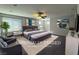 Staged bedroom features gray walls, gray carpet and a ceiling fan at 22 Kaku Ridge Way, Las Vegas, NV 89183