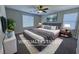 Relaxing bedroom with a king-sized bed, soft rug, and modern decor, creating a serene retreat at 22 Kaku Ridge Way, Las Vegas, NV 89183