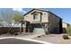 Charming two-story home with an attached garage and paved driveway at 22 Kaku Ridge Way, Las Vegas, NV 89183