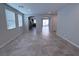 Bright living room features an open floor plan with modern tile floors at 22 Kaku Ridge Way, Las Vegas, NV 89183