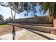 Spacious backyard with tiered planters, desert landscaping, and a concrete patio, offering ample space for outdoor enjoyment at 2205 Mccoig Ave, Las Vegas, NV 89119