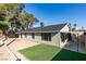 Spacious backyard features low maintenance desert landscaping and a small patch of artificial grass at 2205 Mccoig Ave, Las Vegas, NV 89119