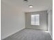 Neutral bedroom with carpet, a window, and baseboards and a closet at 2205 Mccoig Ave, Las Vegas, NV 89119