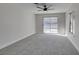 Spacious carpeted bedroom with a sliding door that provides backyard access at 2205 Mccoig Ave, Las Vegas, NV 89119