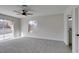Spacious carpeted bedroom with a sliding door that provides backyard access at 2205 Mccoig Ave, Las Vegas, NV 89119
