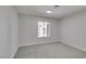 Neutral bedroom with carpet, a window, and baseboards at 2205 Mccoig Ave, Las Vegas, NV 89119