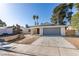 Charming single story home featuring desert landscaping, a two car garage, and neutral colored paint at 2205 Mccoig Ave, Las Vegas, NV 89119