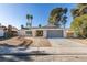 Charming single story home featuring desert landscaping, a two car garage, and neutral colored paint at 2205 Mccoig Ave, Las Vegas, NV 89119