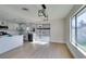 Updated kitchen with granite countertops, stainless steel appliances, and a view of the backyard at 2205 Mccoig Ave, Las Vegas, NV 89119