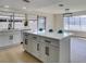 Modern kitchen island with sleek cabinets and a view to outdoor patio at 2205 Mccoig Ave, Las Vegas, NV 89119