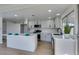 Modern kitchen with stainless steel appliances, white cabinets, quartz countertops, and recessed lighting at 2205 Mccoig Ave, Las Vegas, NV 89119
