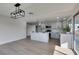 Updated kitchen with granite countertops, stainless steel appliances, and a view of the backyard at 2205 Mccoig Ave, Las Vegas, NV 89119