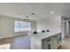 Bright eat-in kitchen with white quartz countertops, island and view to a large window at 2205 Mccoig Ave, Las Vegas, NV 89119