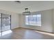 Bright living room with hardwood floors, sliding glass doors, and large windows with backyard view at 2205 Mccoig Ave, Las Vegas, NV 89119