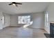 Spacious living room with a large window and modern wood-look flooring at 2205 Mccoig Ave, Las Vegas, NV 89119