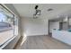Bright, open living room and kitchen area with sleek countertops and a stylish light fixture at 2205 Mccoig Ave, Las Vegas, NV 89119
