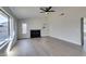 Large living room with lots of windows, wood floors, a black fireplace and a high vaulted ceiling at 2205 Mccoig Ave, Las Vegas, NV 89119