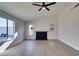 Inviting living room with lots of natural light, wood-look floors, and a cozy fireplace at 2205 Mccoig Ave, Las Vegas, NV 89119