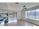Modern living room and kitchen featuring stainless steel appliances and plenty of natural light at 2205 Mccoig Ave, Las Vegas, NV 89119