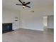 Bright living room with vaulted ceiling, ceiling fan and modern fireplace at 2205 Mccoig Ave, Las Vegas, NV 89119