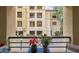 This balcony features room for seating with a view of the building and landscaping below at 230 E Flamingo Rd # 115, Las Vegas, NV 89169