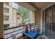 This balcony features room for seating with a view of the building and landscaping below at 230 E Flamingo Rd # 115, Las Vegas, NV 89169