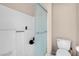 Bright bathroom showcasing a glass shower door and a standard toilet at 230 E Flamingo Rd # 115, Las Vegas, NV 89169