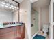 Bathroom featuring a glass enclosed shower and a granite countertop vanity at 230 E Flamingo Rd # 115, Las Vegas, NV 89169