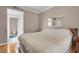 Clean and cozy bedroom features a warm aesthetic and bathroom access at 230 E Flamingo Rd # 115, Las Vegas, NV 89169