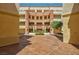 This building's courtyard features lush landscaping with a central water feature and colonnade at 230 E Flamingo Rd # 115, Las Vegas, NV 89169