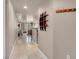 Long hallway with tile floors leading to open living area and bedrooms at 230 E Flamingo Rd # 115, Las Vegas, NV 89169