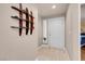Entryway showcasing modern decor with tile flooring and leading to a white front door at 230 E Flamingo Rd # 115, Las Vegas, NV 89169