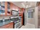 Well-appointed kitchen featuring granite countertops, stainless appliances, and ample cabinet space at 230 E Flamingo Rd # 115, Las Vegas, NV 89169