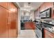 Charming kitchen with stainless steel appliances, plenty of cabinets, and granite counters at 230 E Flamingo Rd # 115, Las Vegas, NV 89169