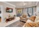Bright living room with a sliding glass door to a balcony, plush seating, and a stylish area rug at 230 E Flamingo Rd # 115, Las Vegas, NV 89169