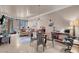 Open concept living area with modern lighting, tile flooring, and a cozy seating arrangement at 230 E Flamingo Rd # 115, Las Vegas, NV 89169