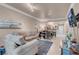 Open living and dining area featuring modern furnishings, neutral decor, and tile floors at 230 E Flamingo Rd # 115, Las Vegas, NV 89169